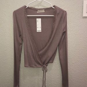 A dark lavender long sleeve top